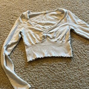 Cream colored long sleeve crop top, super cute but I have one just like this